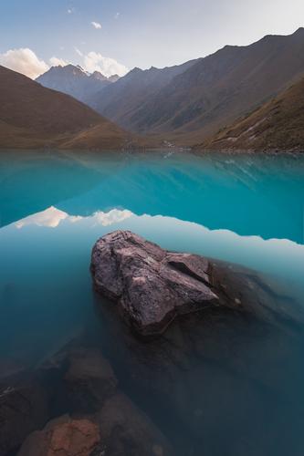 Incredible turquoise lake of Kol Tor at sunset, Kyrgyzstan