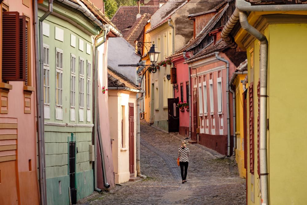 A woman in the medieval streets of Sighișoara, Romania
